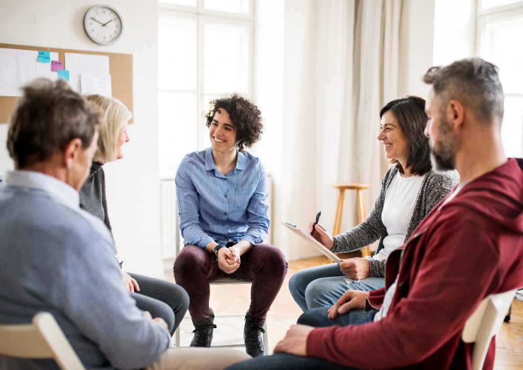 A therapeutic group sitting in a circle